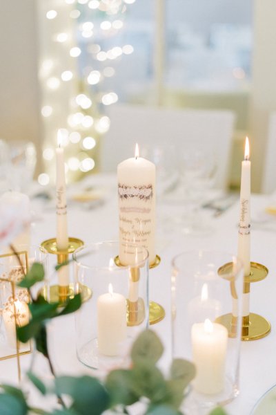 Candle detail flowers lights in background