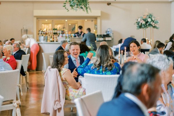 Guests sit in dining room