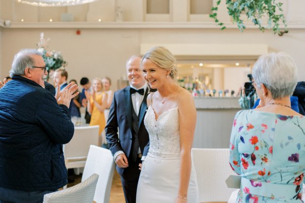 Bride and groom with guests