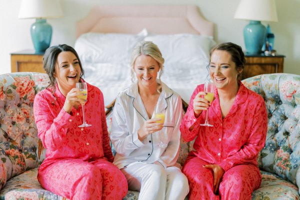 Bridesmaids and bride drinking orange juice prosecco