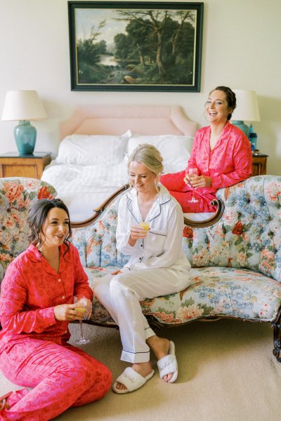 Bridesmaids and bride drinking orange juice prosecco