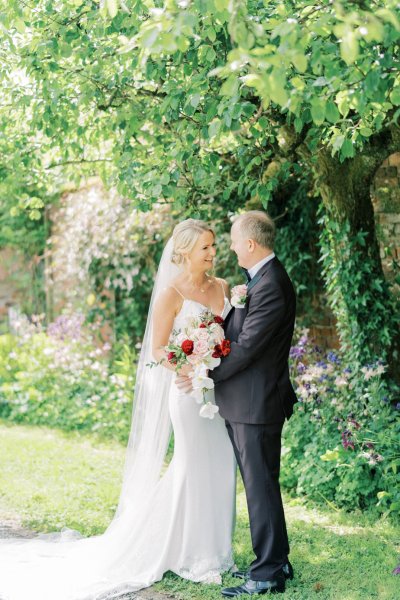 Bride groom laughing in garden park