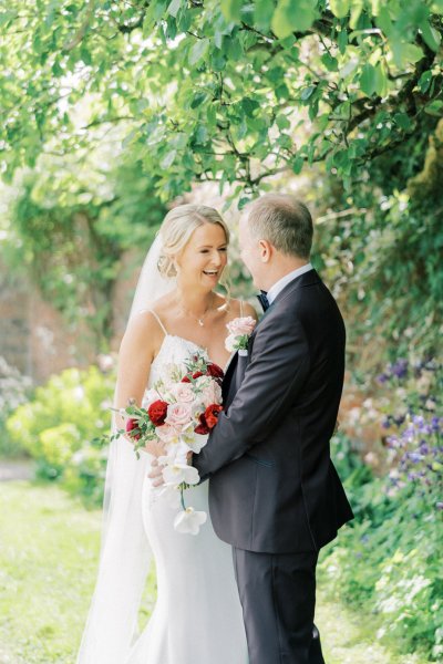 Bride groom laughing in garden park