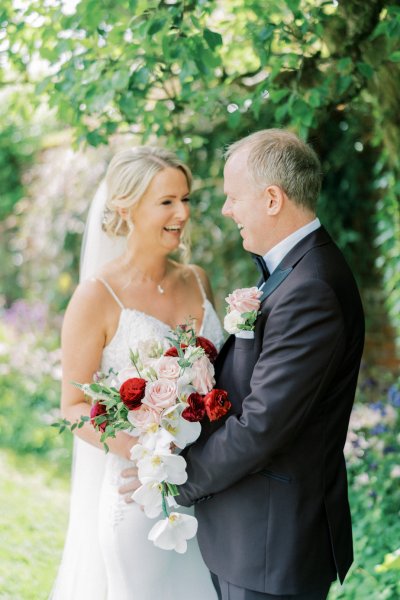 Bride groom laughing in garden park