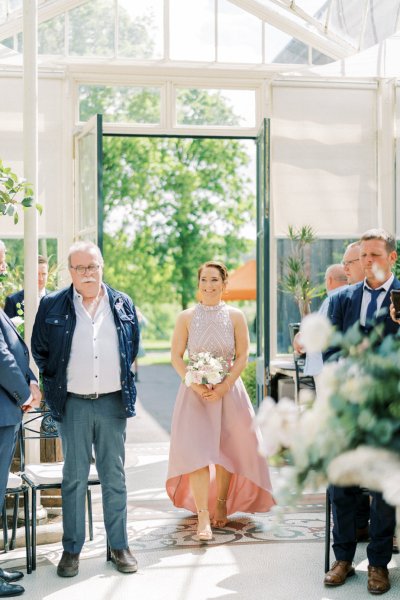 Bridesmaid walking down aisle wedding