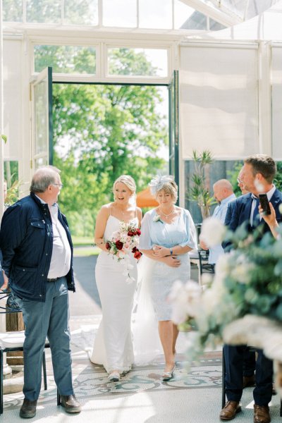 Bride mother aisle wedding ceremony