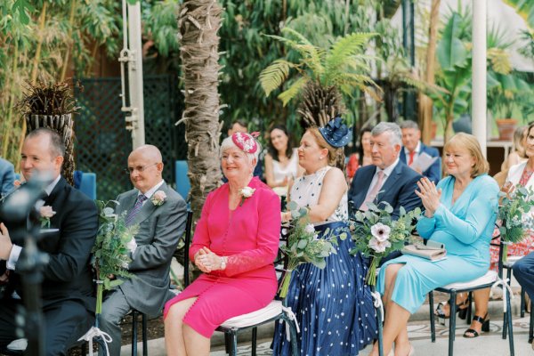 Guests sitting during wedding ceremony