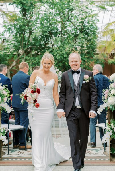 Bride groom walk down the aisle ceremony guests