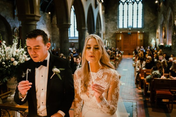 Bride groom alter church guests priest