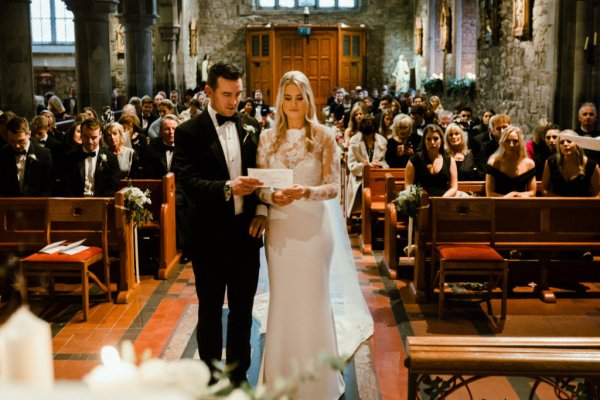 Bride groom alter church guests priest