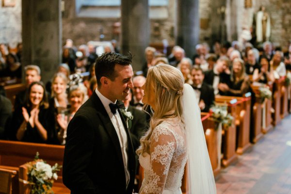 Bride groom wedding just wed husband and wife kissing at alter