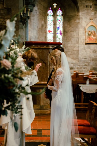 Bride groom flowers alter church