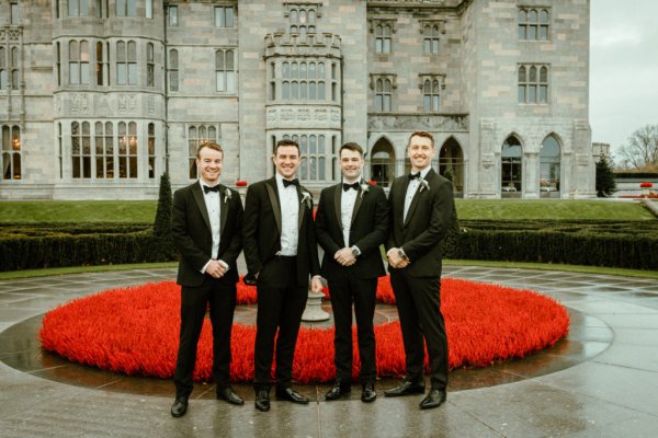 Rose bush groom groomsmen exterior venue manor