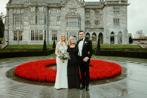 Bride mother groom exterior rose bush manor castle wedding venue