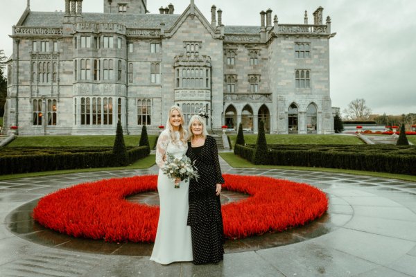 Bride mother exterior rose bush manor castle wedding venue