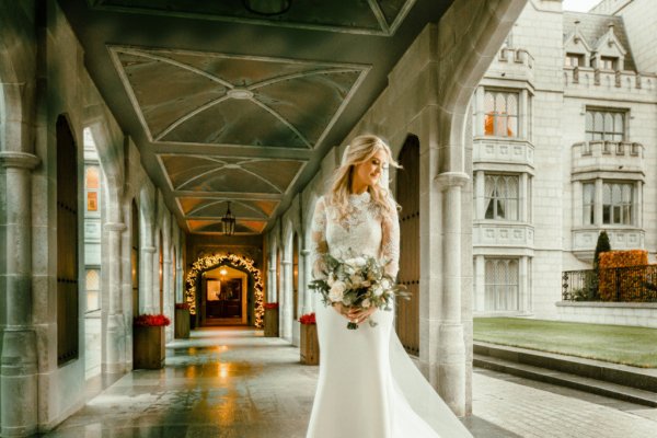 Bride on her own interior venue flowers bouquet