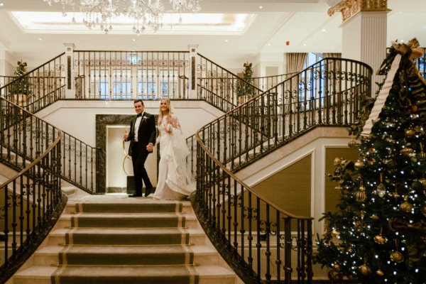 Bride groom walking down stairs