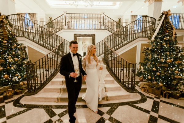 Bride groom walking down stairs