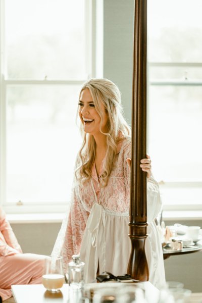 Bride laughing in room