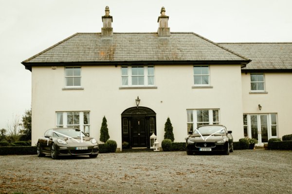 Black wedding cars exterior venue