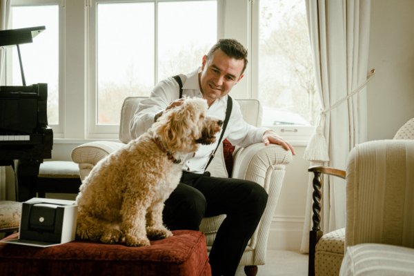 Groom and dog