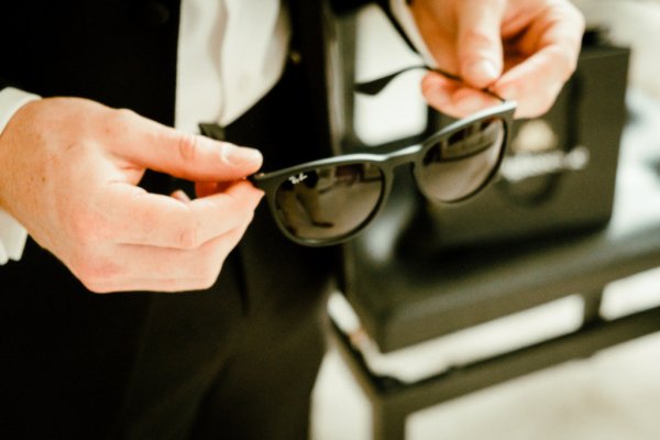 Black sunglasses suit tie