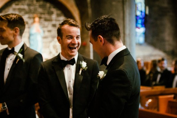 Groom groomsmen alter church guests