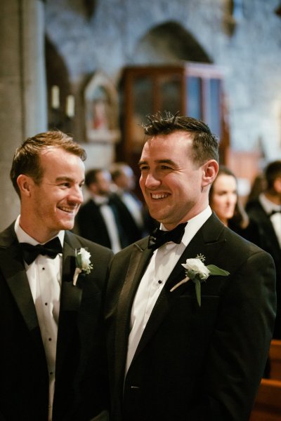 Groom crying flower black suit