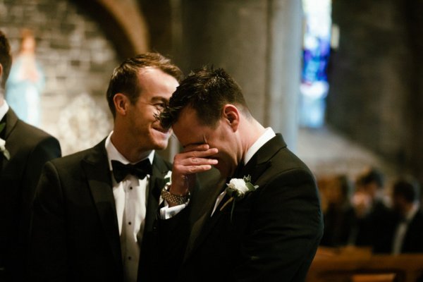 Groom crying flower black suit