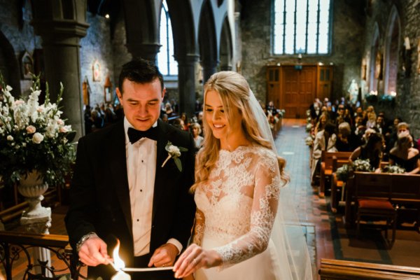 Bride groom alter church guests priest