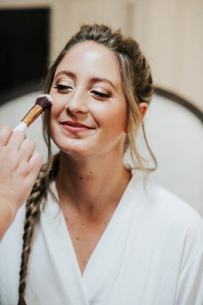 Bride getting her makeup done MUA blush