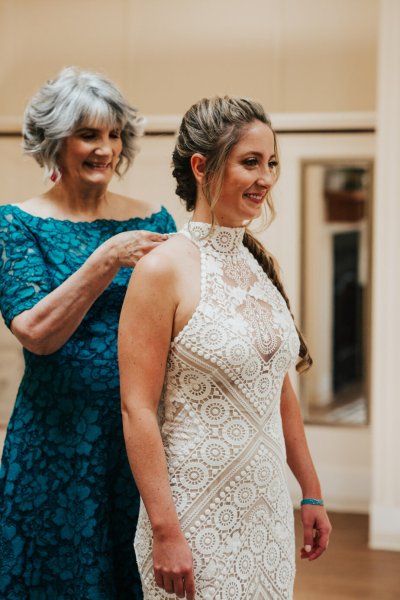 Bride helping mum mother blue dress zip