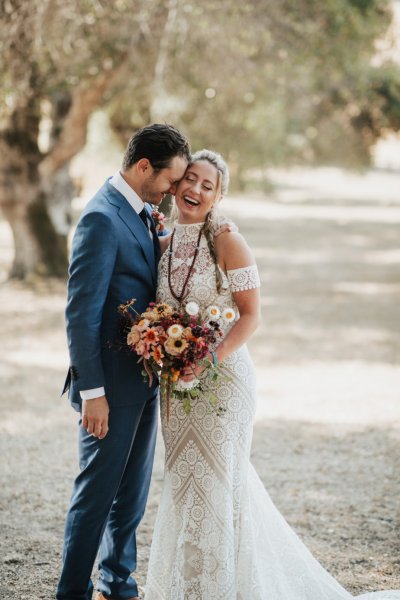 Bride groom forest park tree sunshine bouquet flowers hay field