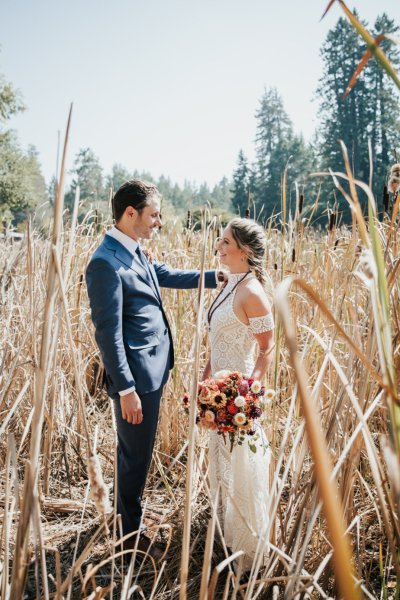 Bride groom forest park tree sunshine bouquet flowers hay field