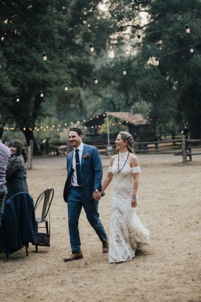 Bride and groom holding hands hand in hand