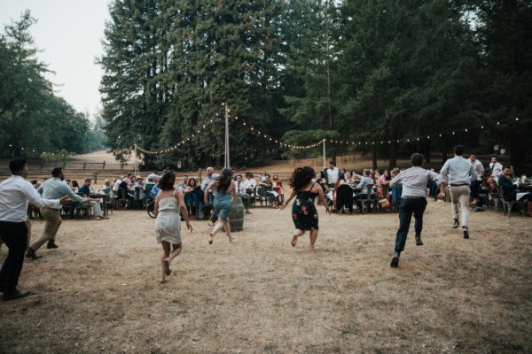 Guests running games wedding park