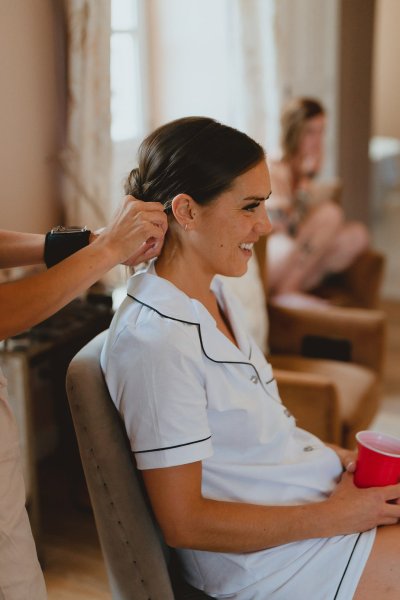 Bride getting ready hair MUA hairstyle earrings