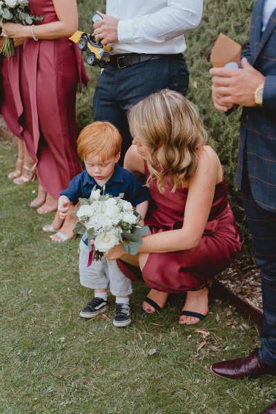 Little child bridesmaid mother flowers