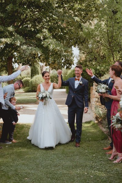 Bride groom grass ceremony clapping guests