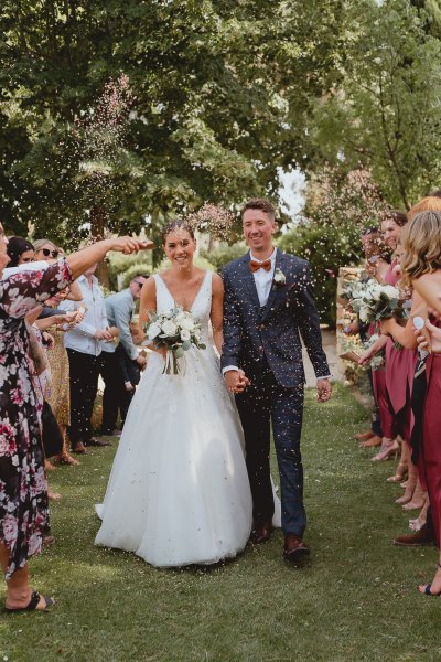 Bride groom grass ceremony clapping guests