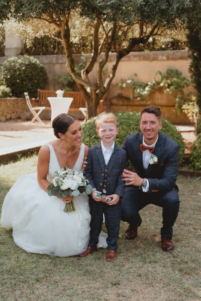 Bride groom flowers and child