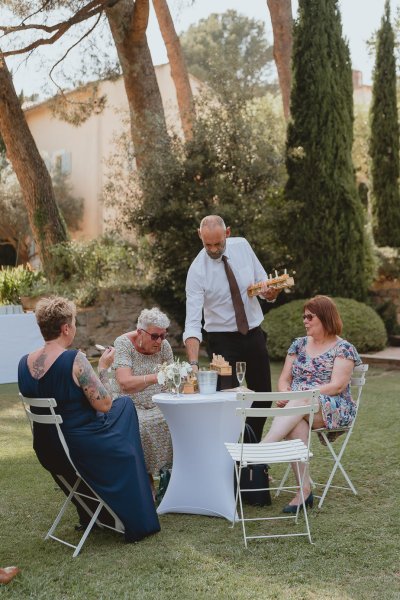 Guests gather good weather exterior dining eating