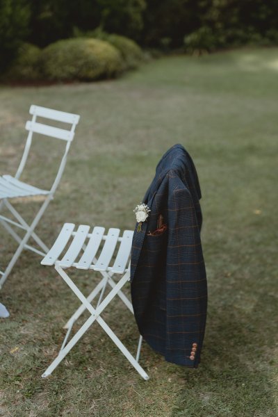 Suit jacket on back of chair