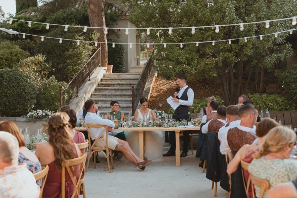 Groom gives speech at wedding ceremony bride