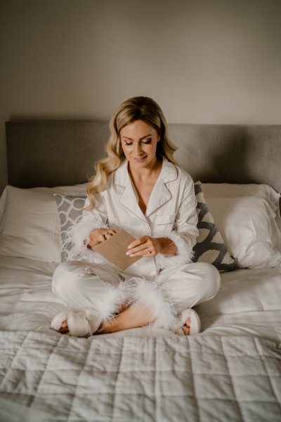 Bride pajamas reading letter bed bedroom