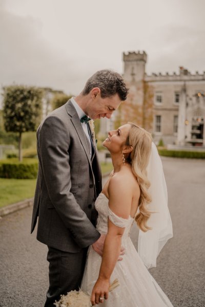 Couple after wedding ceremony bride groom bouquet flowers