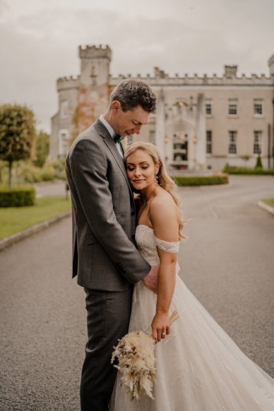 Couple after wedding ceremony bride groom bouquet flowers