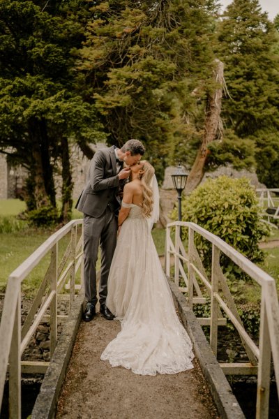 Couple bride groom kiss on bridge