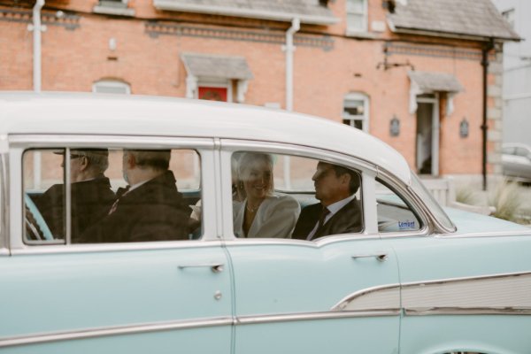 Couple in wedding car