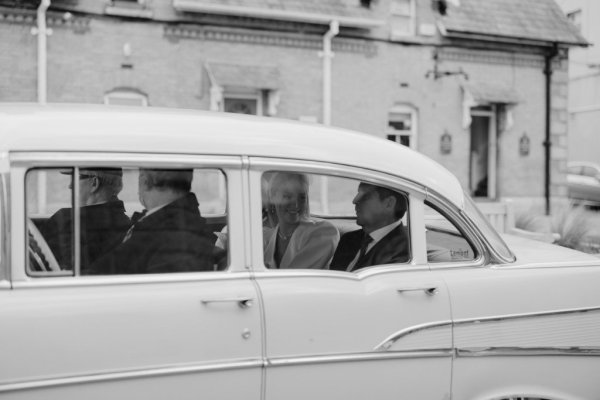 Wedding car with groom inside